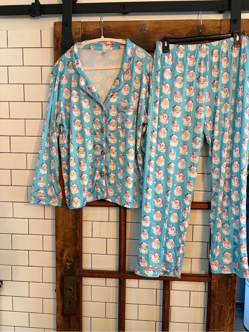two-piece pajama set featuring an all-over repeating vintage Santa Claus face LG